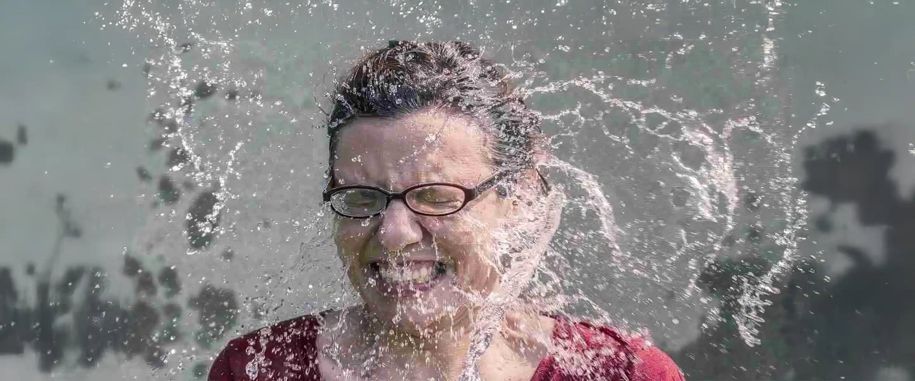 Water splashing in woman's face