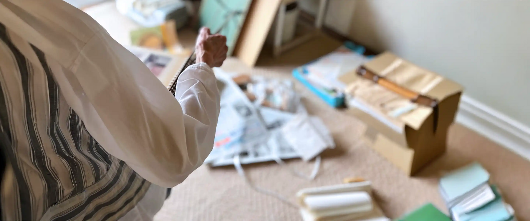 Elderly woman decluttering room