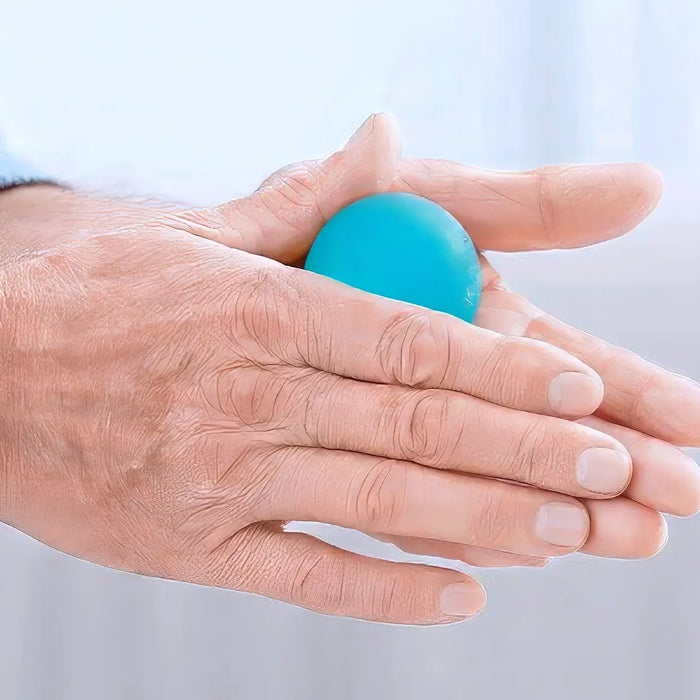 Hands of senior man doing exercise with rubber ball