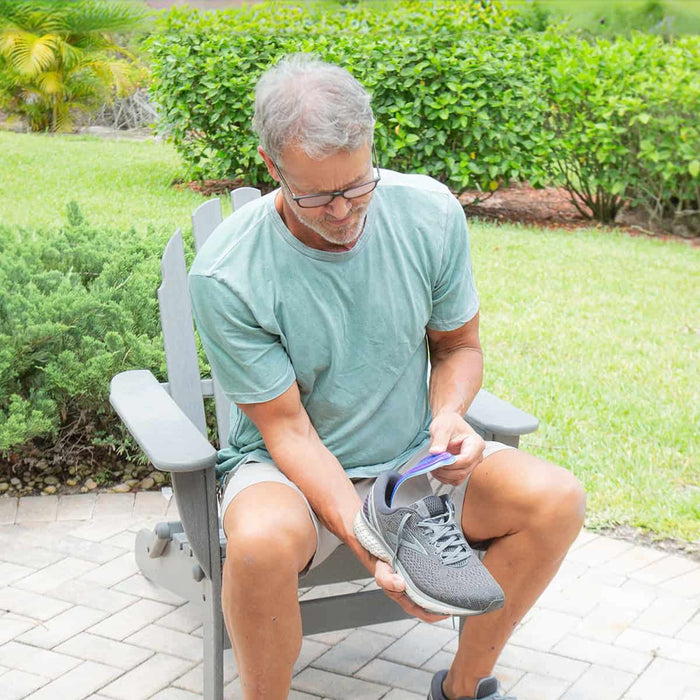 Man fitting insoles