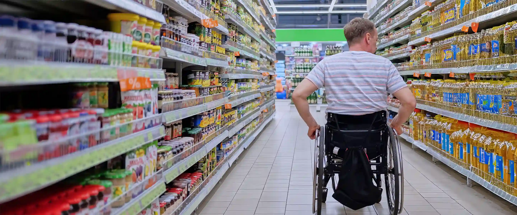 man shopping in wheelchair