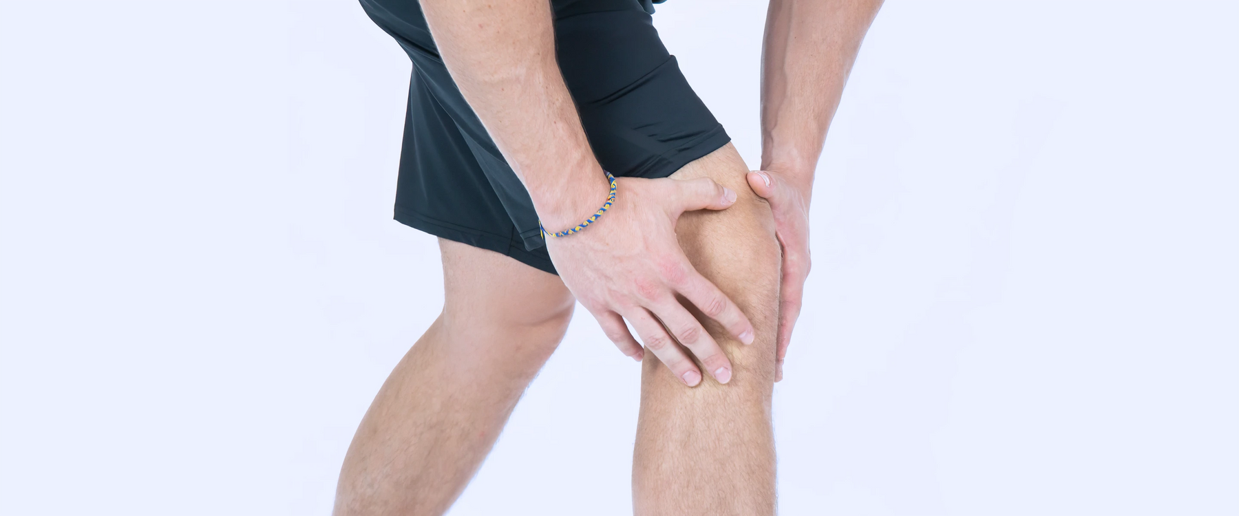 Holding painful kneecap