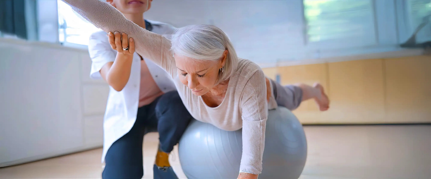 Senior Woman Exercising Her Physiotherapist