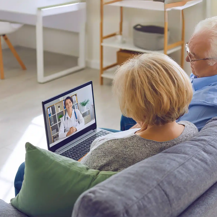 Senior using telemedicine services at home