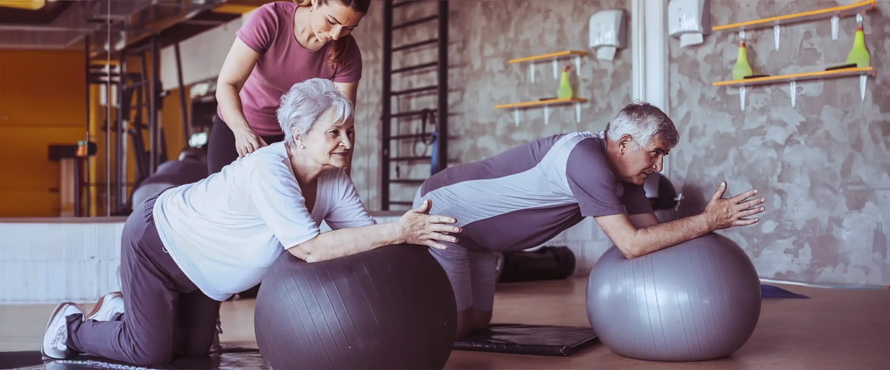 Senior people on pilates ball