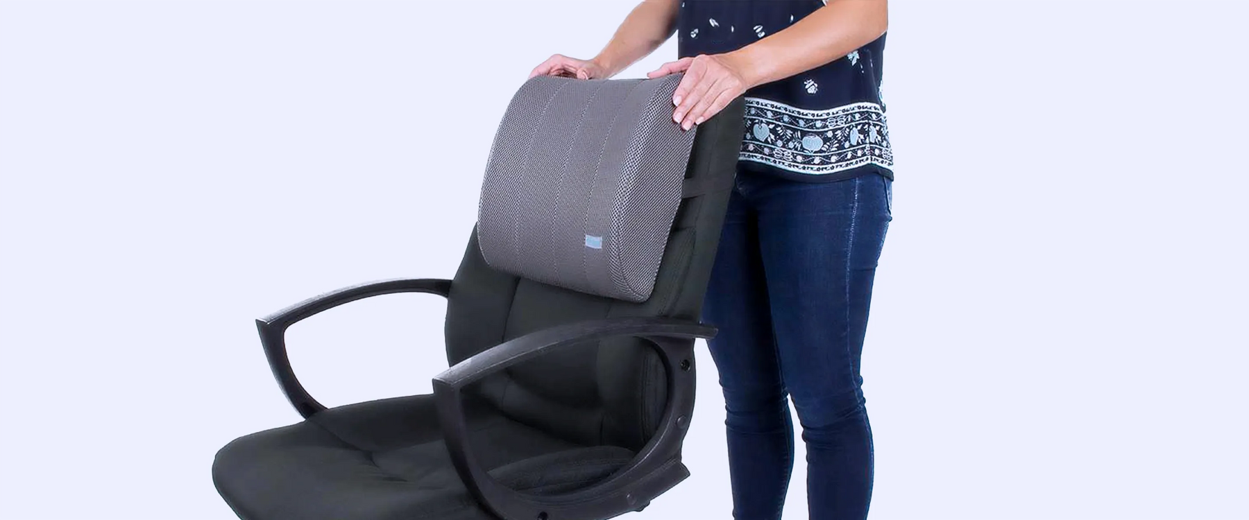 Woman holding a lumbar cushion on the chair