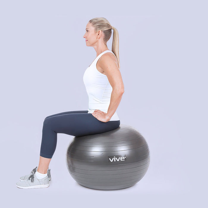 Woman sitting on a yoga ball