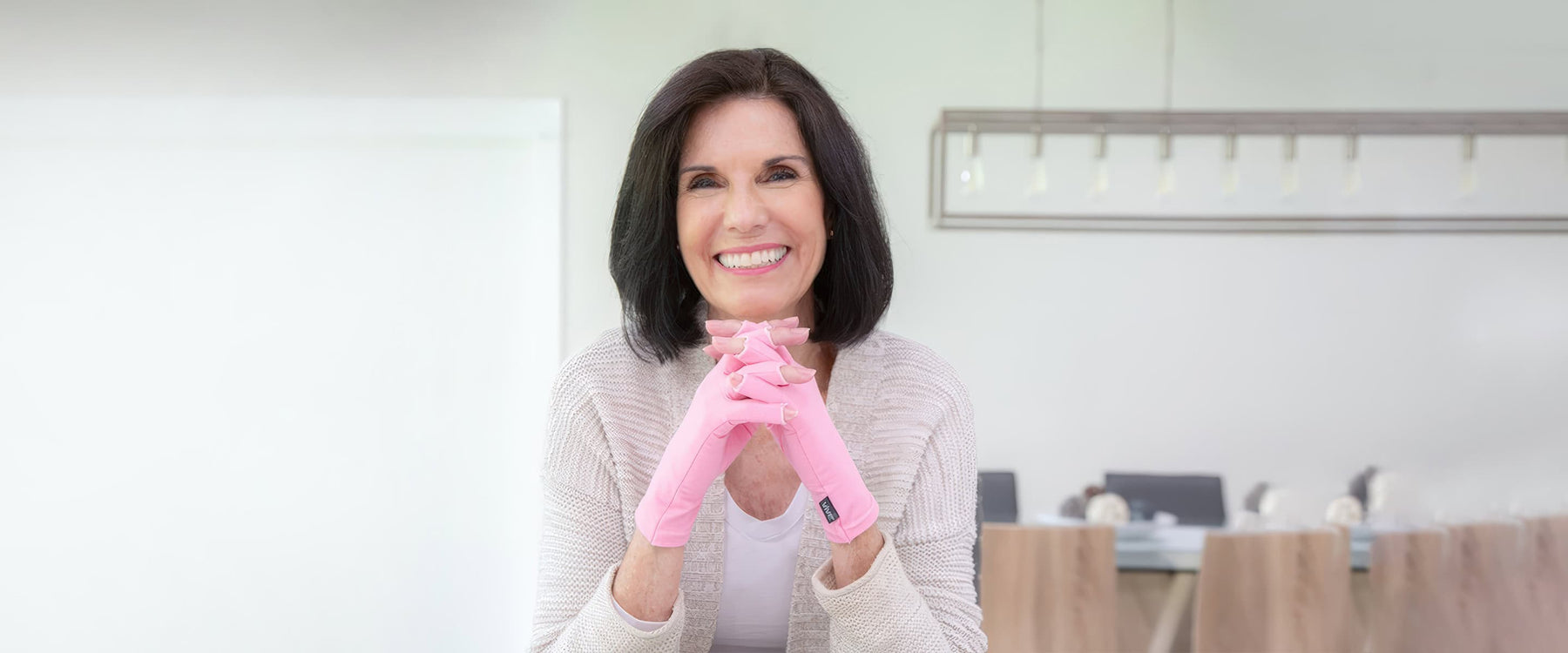 Woman wearing arthritis gloves