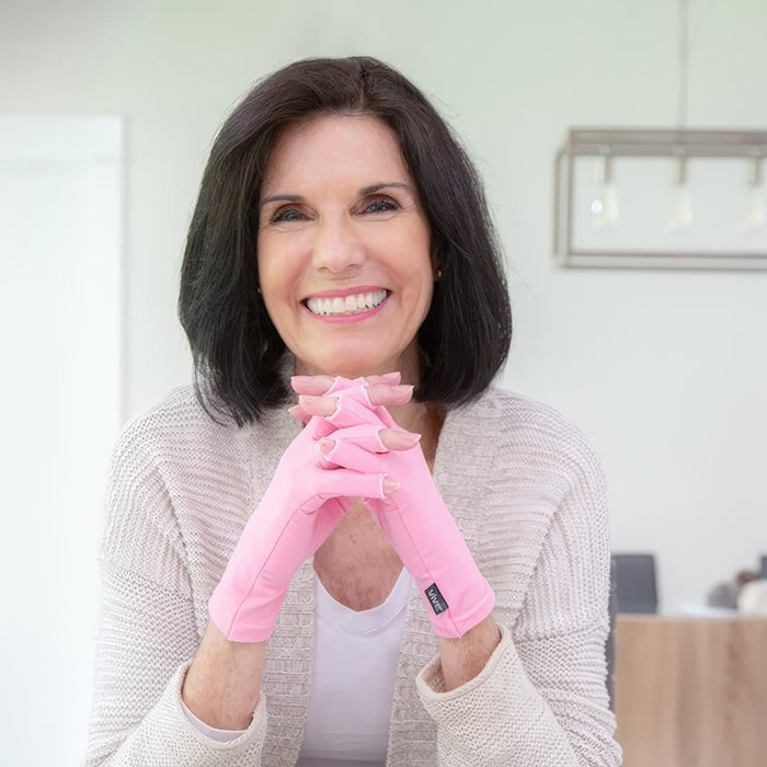 Woman wearing arthritis gloves