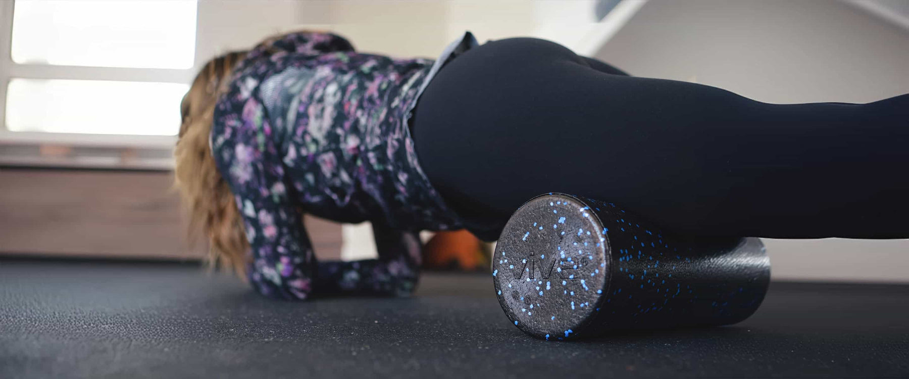 Woman using foam roller massage