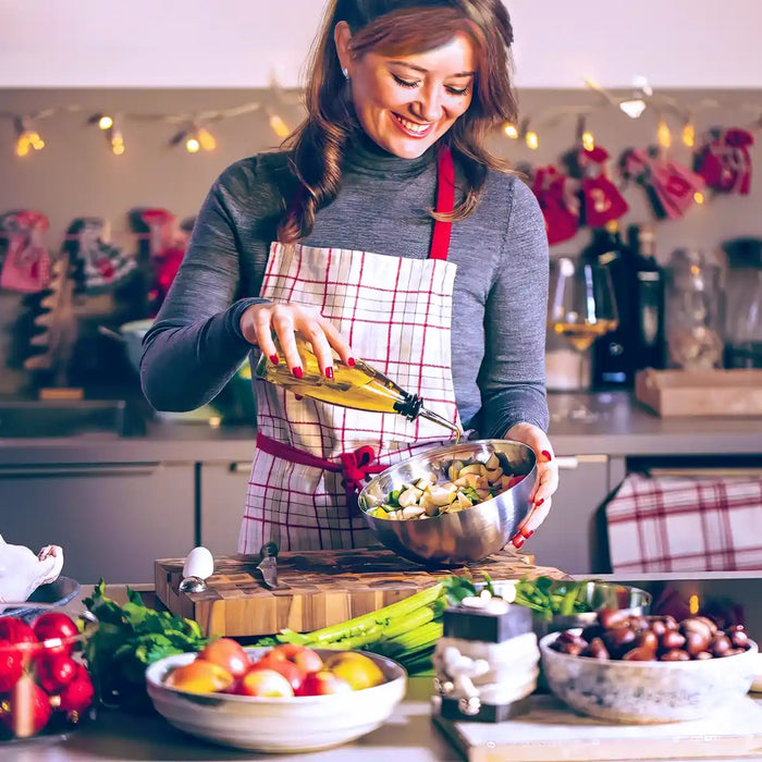 Young Woman Cooking in the kitchen. Healthy Food for Christmas