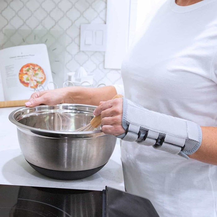 Wearing wrist brace cooking