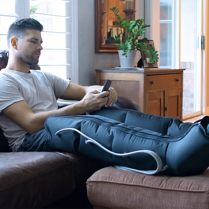 man using leg compression device