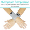 crossed wrists wearing gray compression wrist supports